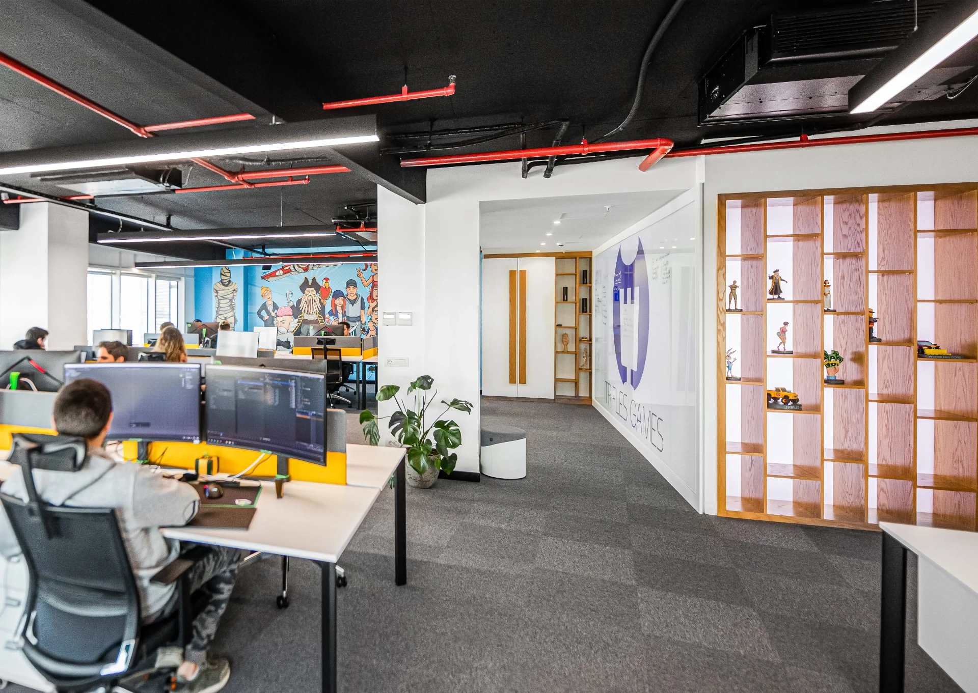 Trifles Games studio workspace with the 29-person team